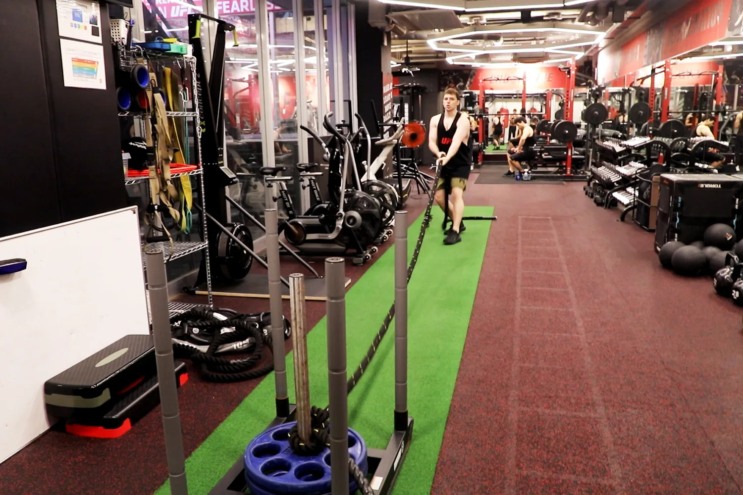 Sled pull training with rope at UFC Gym Yoga